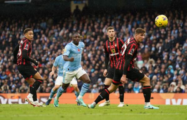 Manchester City's Jeremy Doku scores their side's first goal of the game.