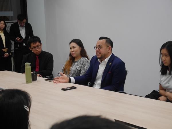 The author (far left) at an engagement session with Sim (second from right). Also present is MP for Kluang and TalentCorp chairperson Wong Shu Qi.